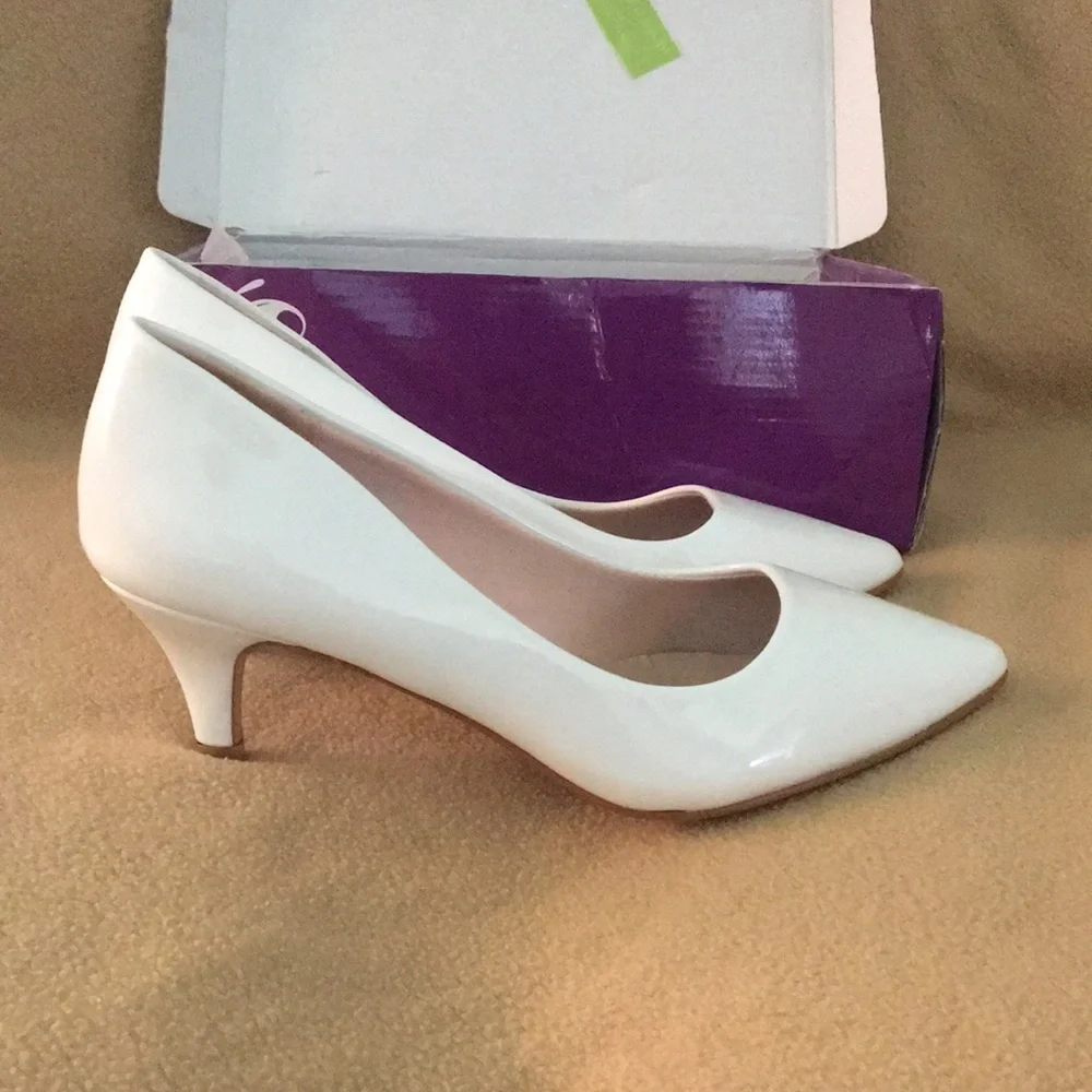 White patent pumps